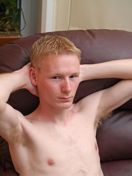 Hot twink strips & jerks his small dick until he ejaculates on the couch