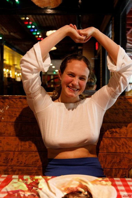 Pretty babe Carrie Barber flashes an upskirt while flaunting her hot legs