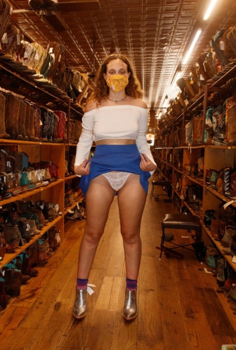 Pretty babe Carrie Barber flashes an upskirt while flaunting her hot legs