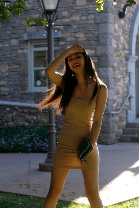 Petite babe Scarlett Alexis shows her hot legs wearing a sexy dress