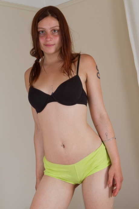Adorable hippie Vanessa exposes a lower back tattoo & her furry snatch