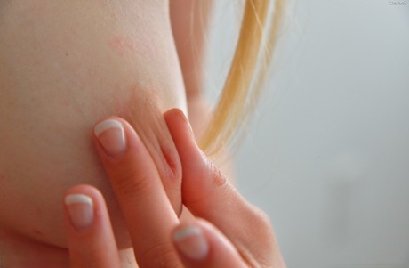 Amateur teen strips to reveal her alluring body & inserts toys anally