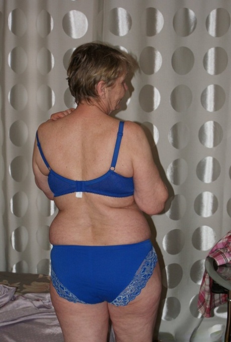 Naughty granny Belly shows off her big booty and spreads her hairy pussy