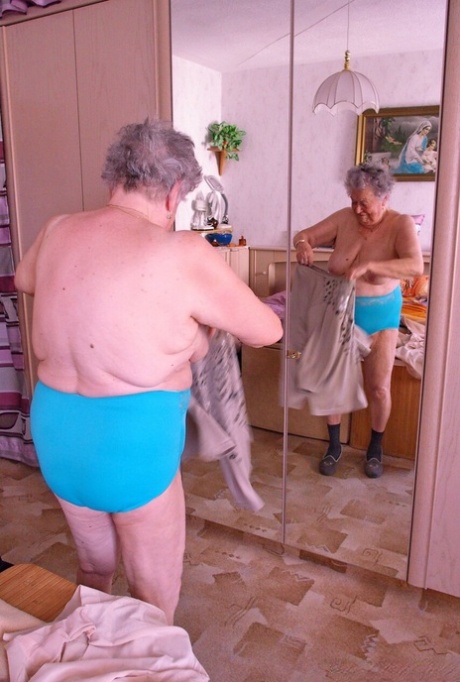 Kinky fat granny Pulcheria poses naked in a solo home striptease