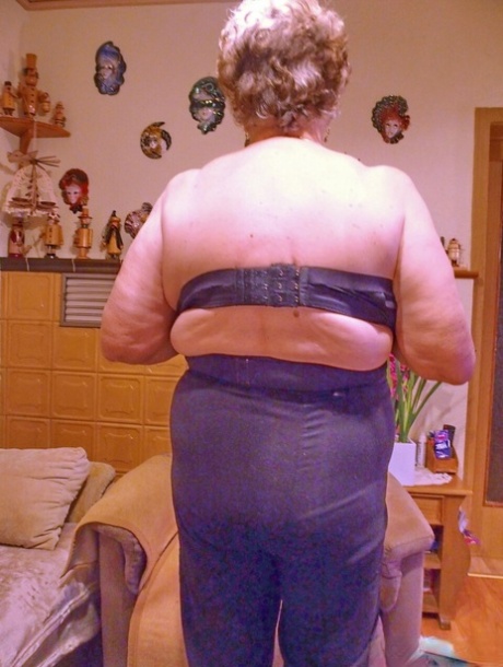 Kinky fat granny Pulcheria poses naked in a solo home striptease