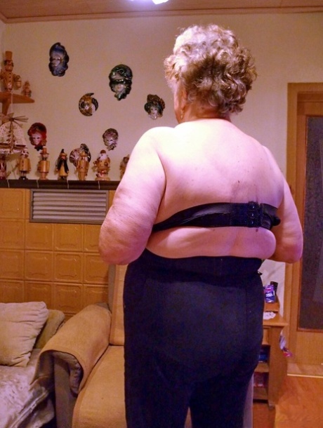 Kinky fat granny Pulcheria poses naked in a solo home striptease