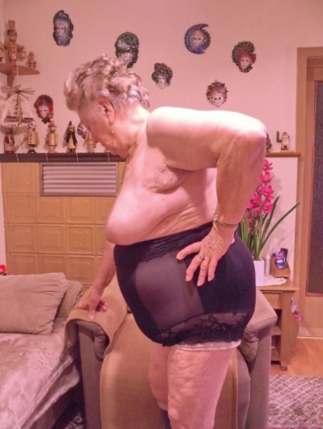 Kinky fat granny Pulcheria poses naked in a solo home striptease
