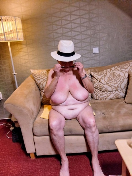 Naughty chubby granny Modesta shows her saggy tits while completely naked