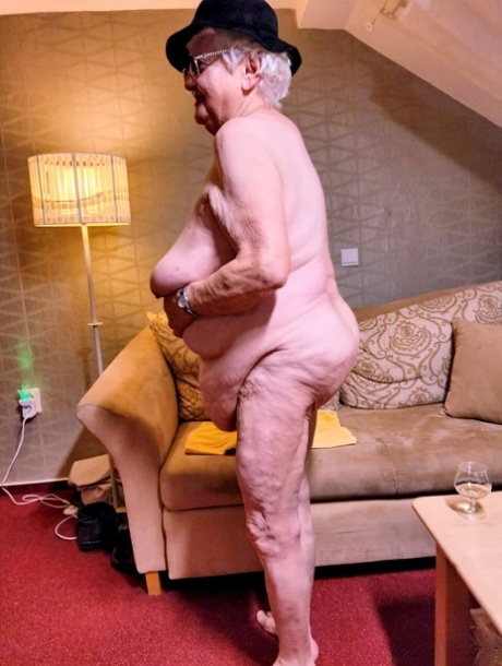 Naughty chubby granny Modesta shows her saggy tits while completely naked