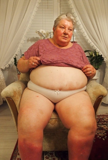 Fat granny Clotilde unveils her saggy tits and sucks a sex toy in a solo