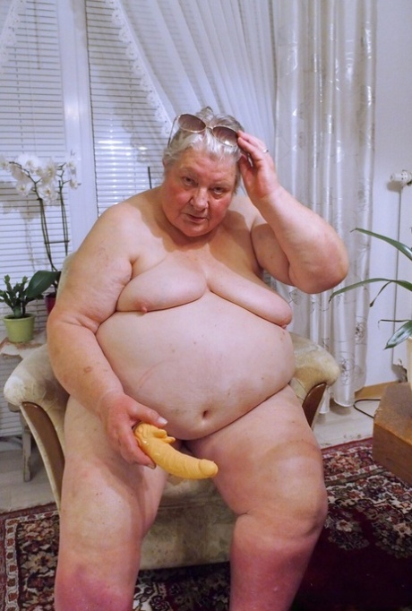 Fat granny Clotilde unveils her saggy tits and sucks a sex toy in a solo